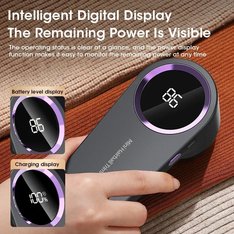 Lint remover with digital display showing battery level and charging status, held by a hand.