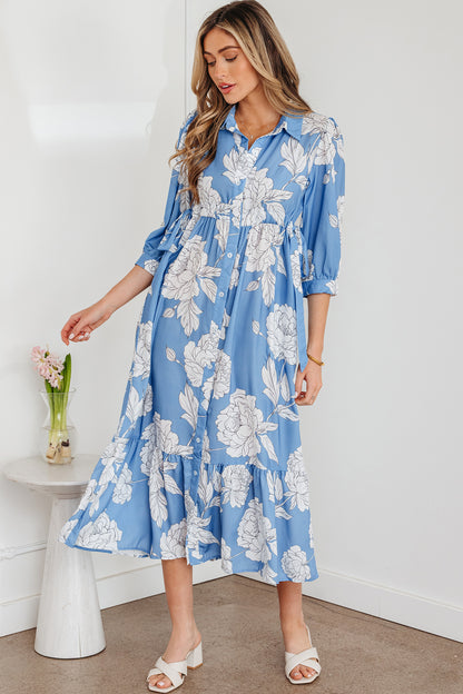 Robe longue bleu ciel à imprimé floral, col boutonné, manches 3/4 et ourlet à volants
