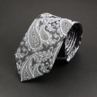 Black paisley patterned tie on a black background