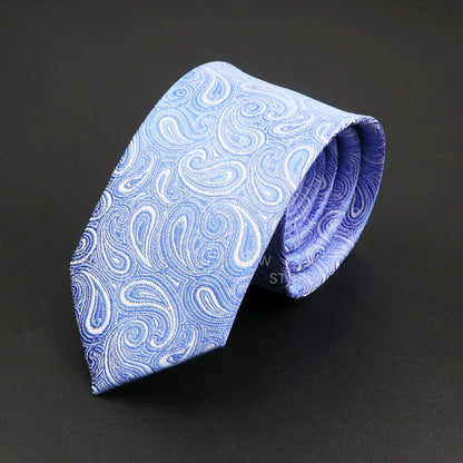 Blue paisley patterned tie on a black background
