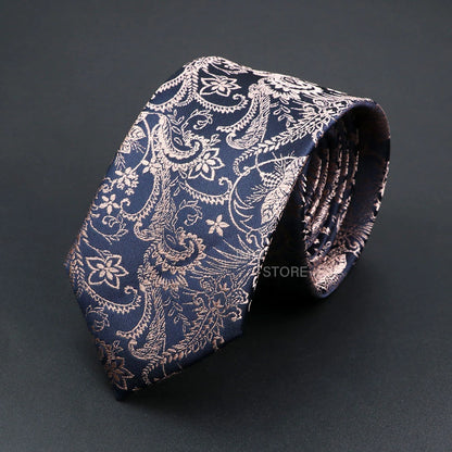 Blue paisley patterned tie on a dark background