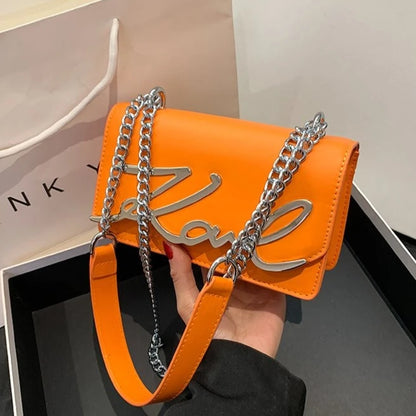 Orange CaRaUaNa Karl Clutch Bag