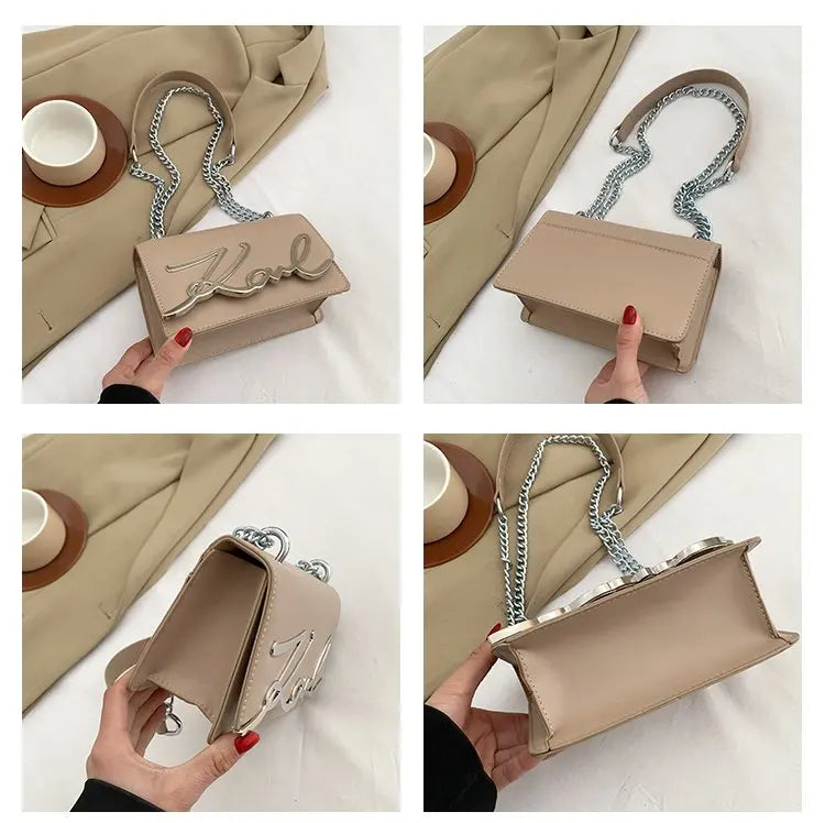 khaki CaRaUaNa Karl Clutch Bag with chain strap held by a hand