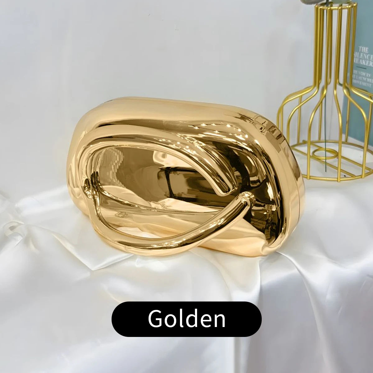 Gold metallic Carauana Festival Clutch Bag  with 'Golden' label