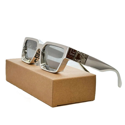Carauana Millionaire GO with reflective lenses on a brown box
