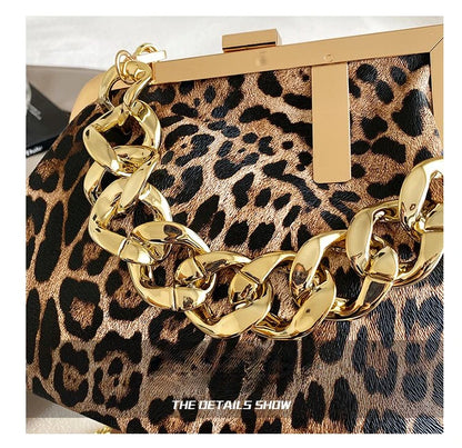 Leopard print clutch with gold chain detail