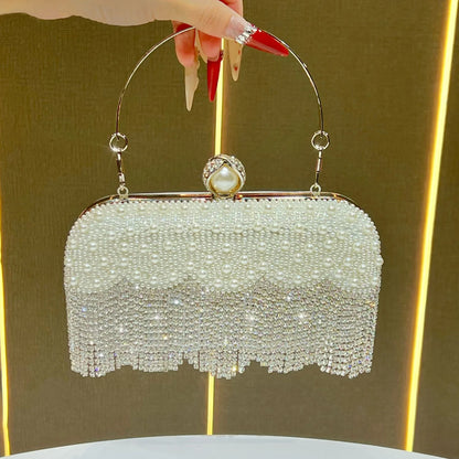 silver_Carauana_Pearl_Clutch_Purse held by a hand